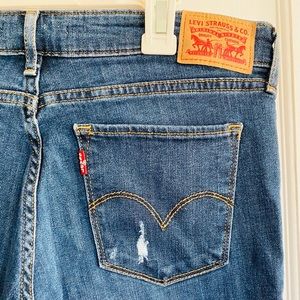Blue jeans with frayed holes